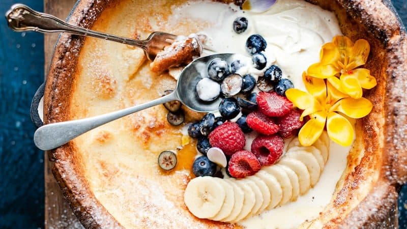 sliced fruit on brown cake