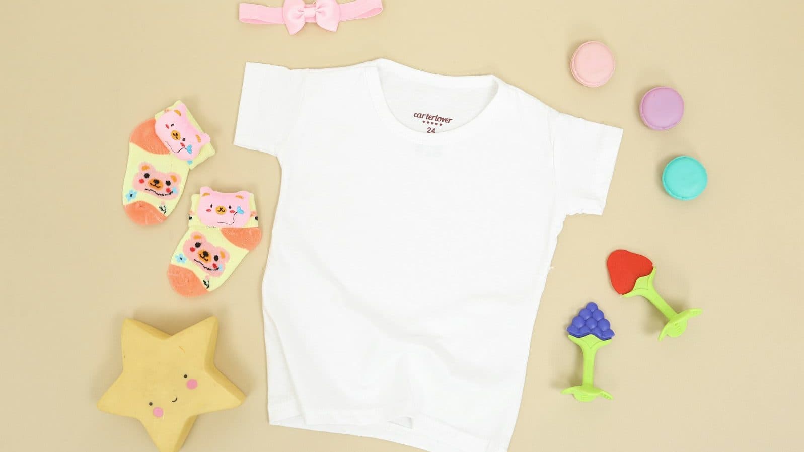 babys white onesie and pink and white bear print onesie